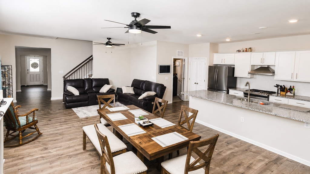 Dining area and kitchen seen from the main gathering space