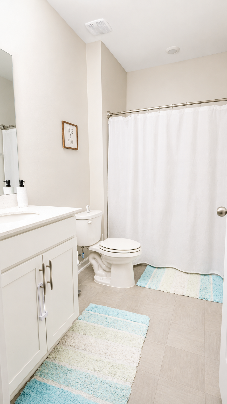 Full bathroom with vanity, tile floor and shower